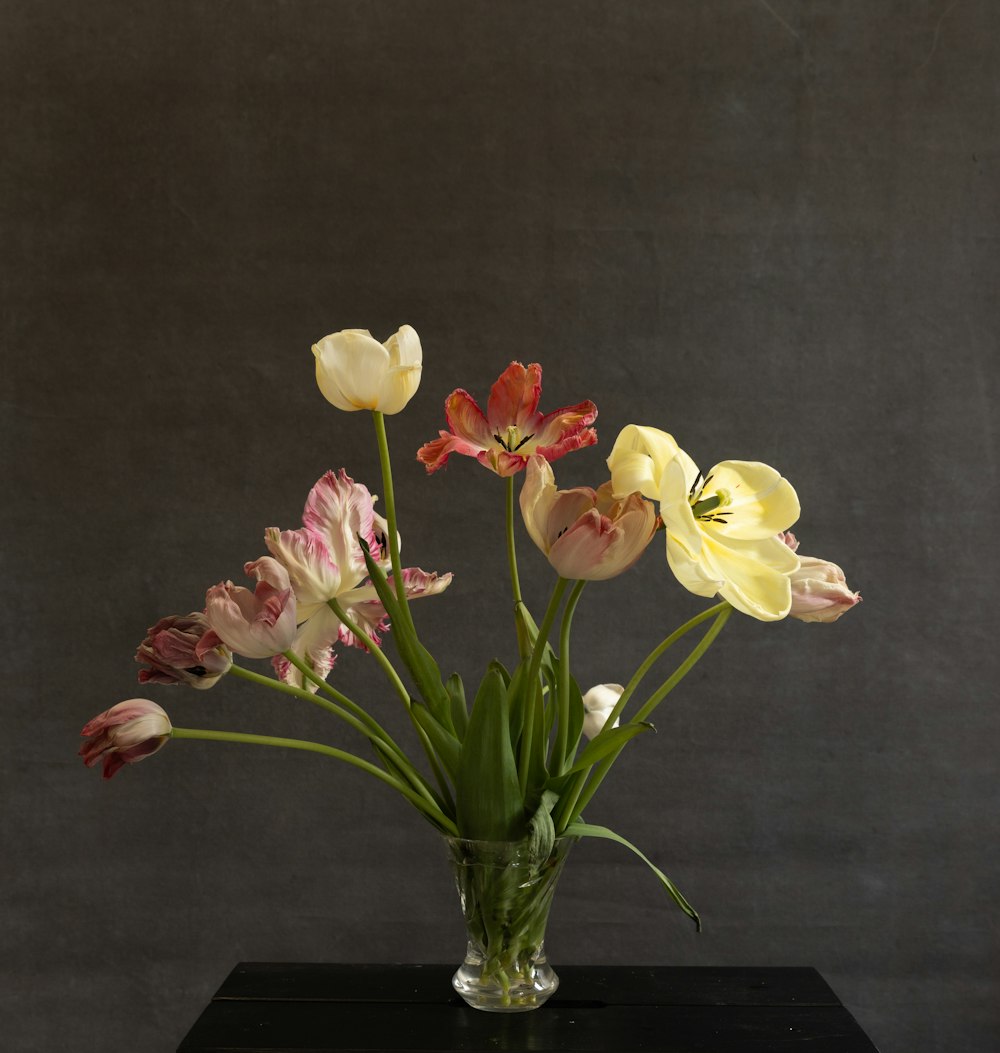 a vase filled with flowers on top of a table