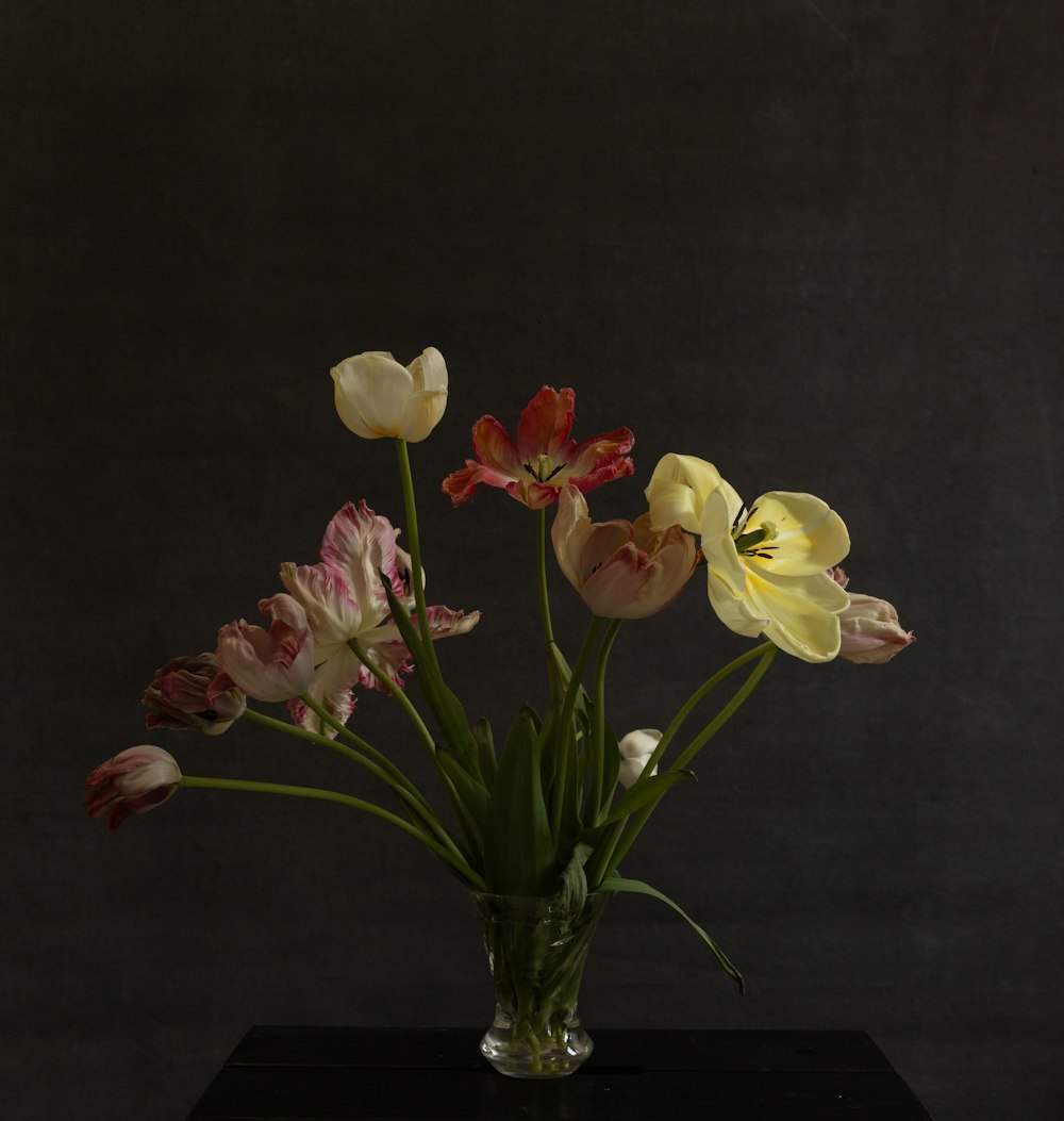 a vase filled with flowers on top of a table