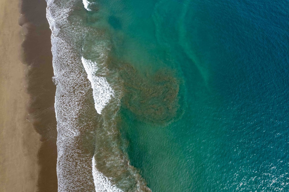 an aerial view of a beach and ocean