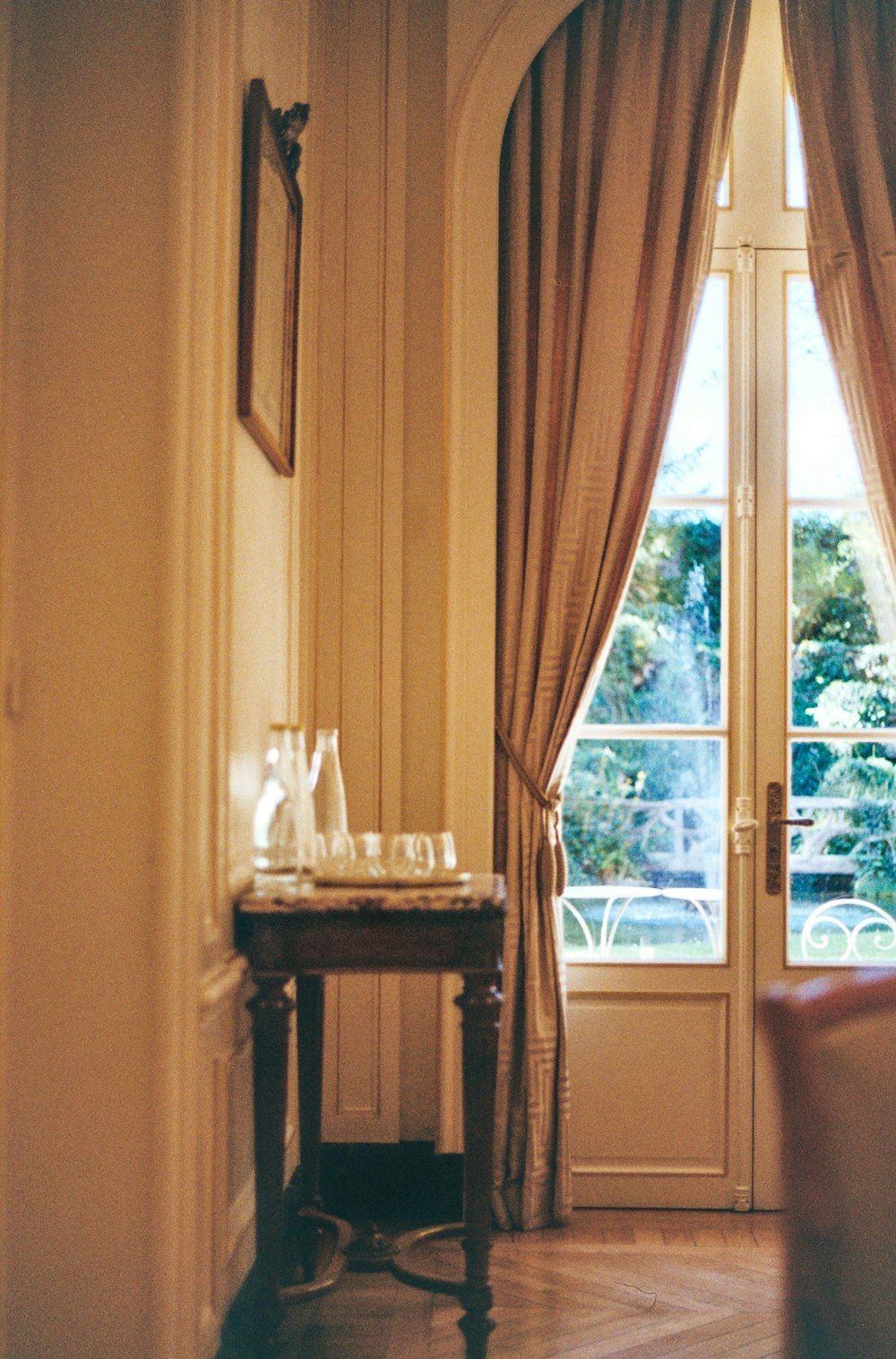 a living room with a chair and a table