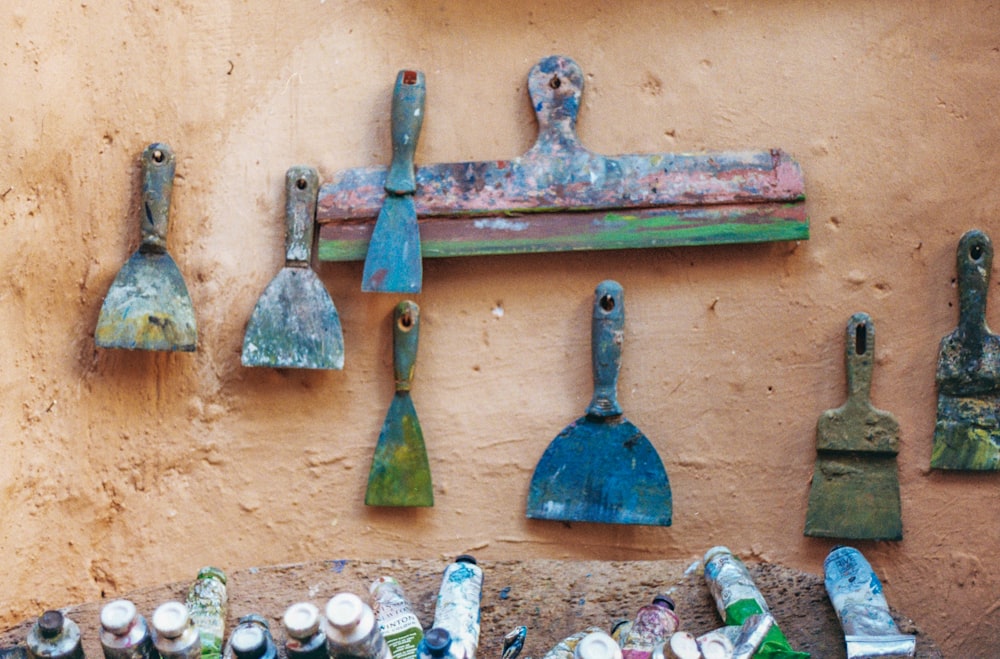 a wall with a bunch of bottles hanging on it