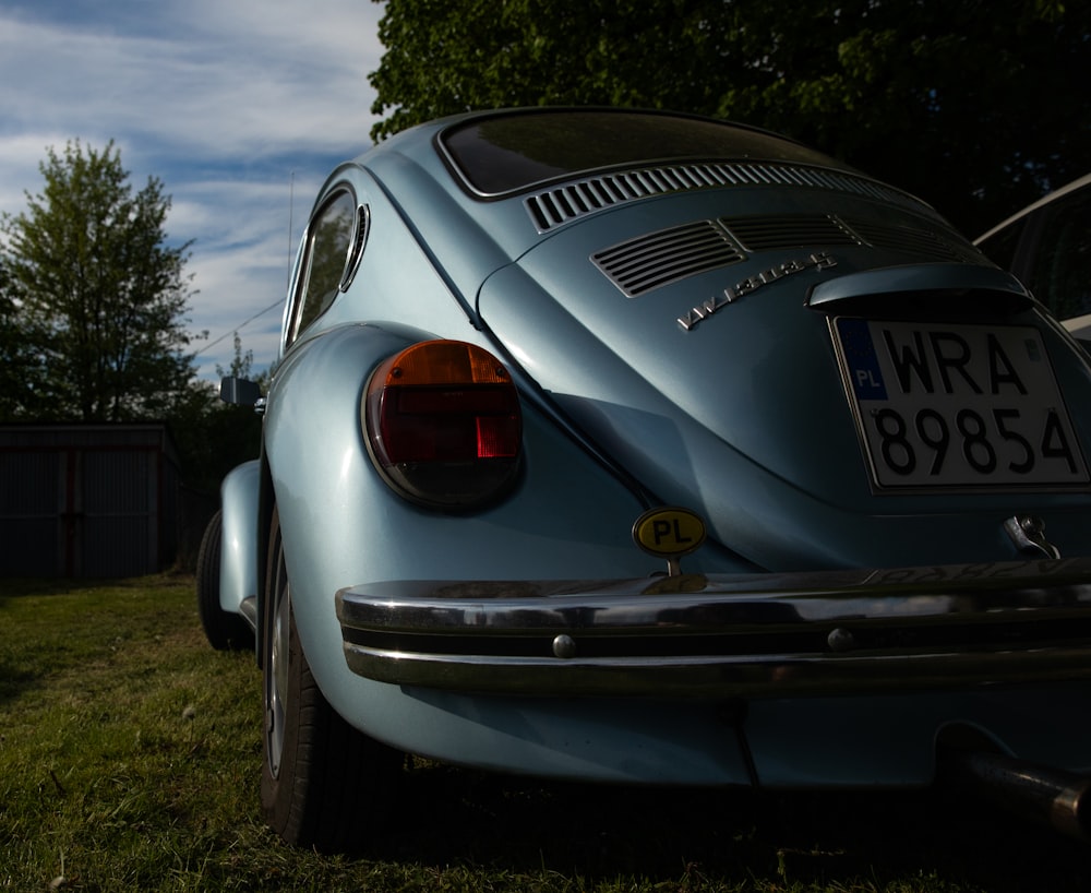 a close up of a car parked in a field