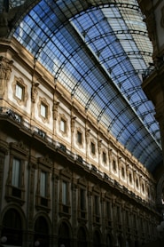 a large building with a glass ceiling and a clock