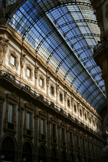 a large building with a glass ceiling and a clock