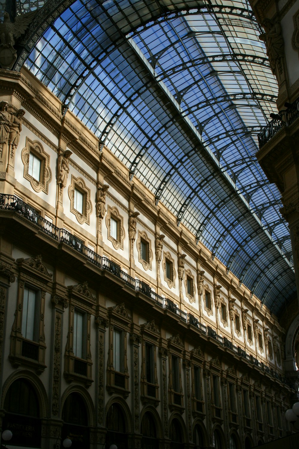 a large building with a glass ceiling and a clock