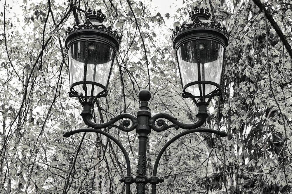 a black and white photo of a street light