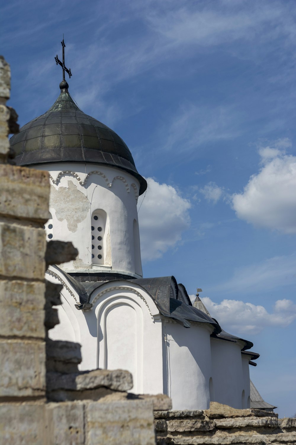 a white building with a cross on top of it