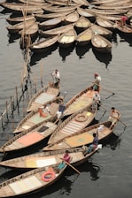 a number of small boats in a body of water