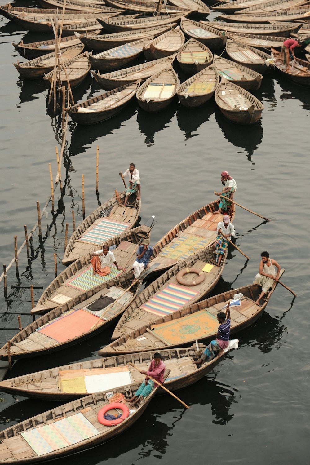 a number of small boats in a body of water