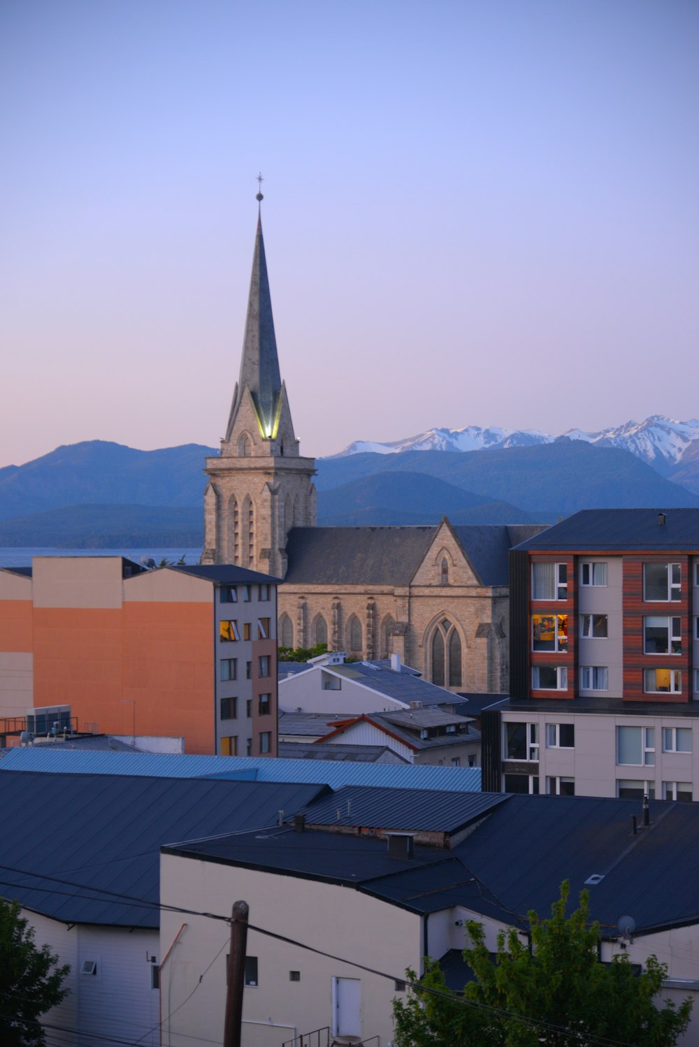 a view of a city with mountains in the background