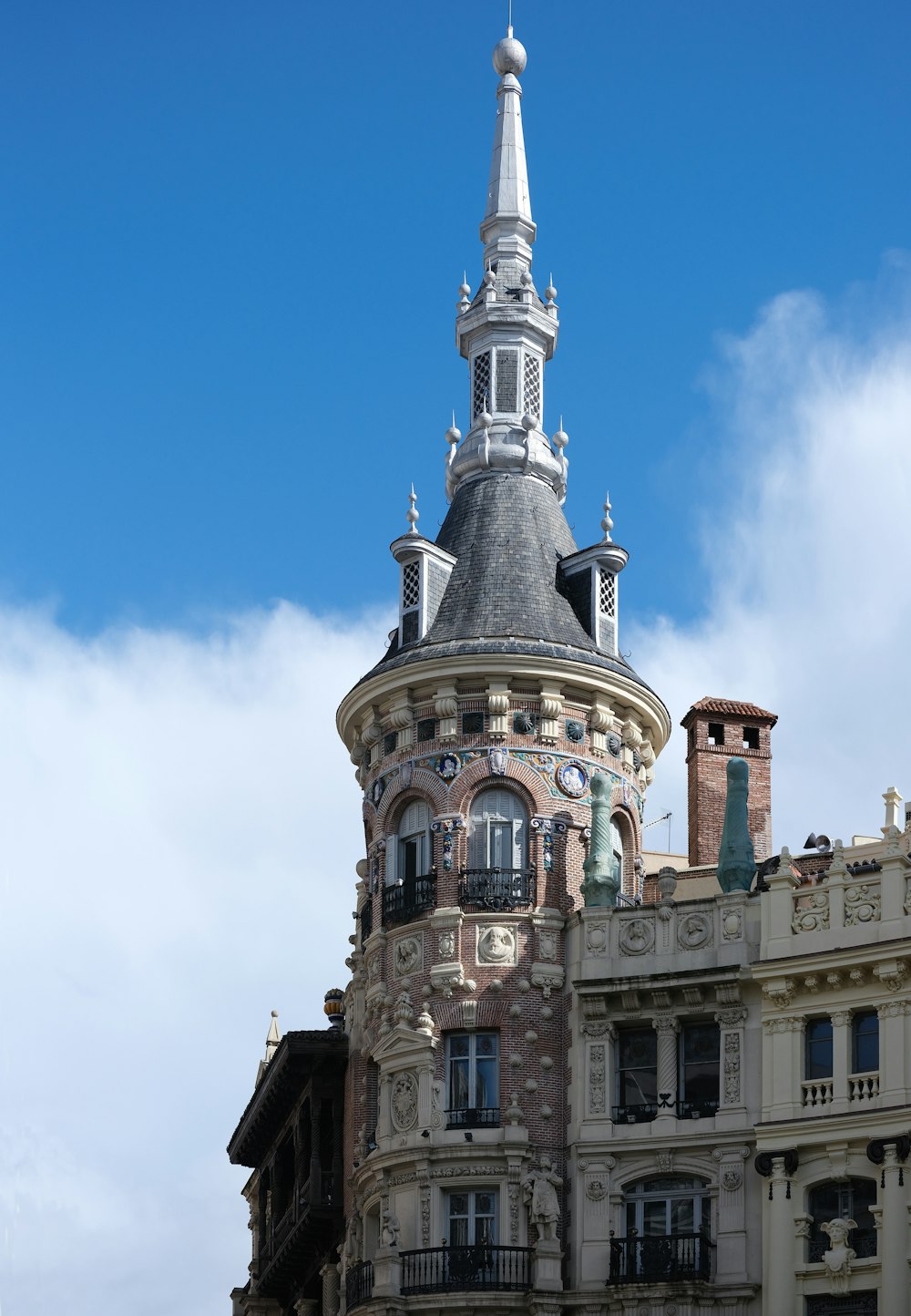 a tall building with a clock on the top of it