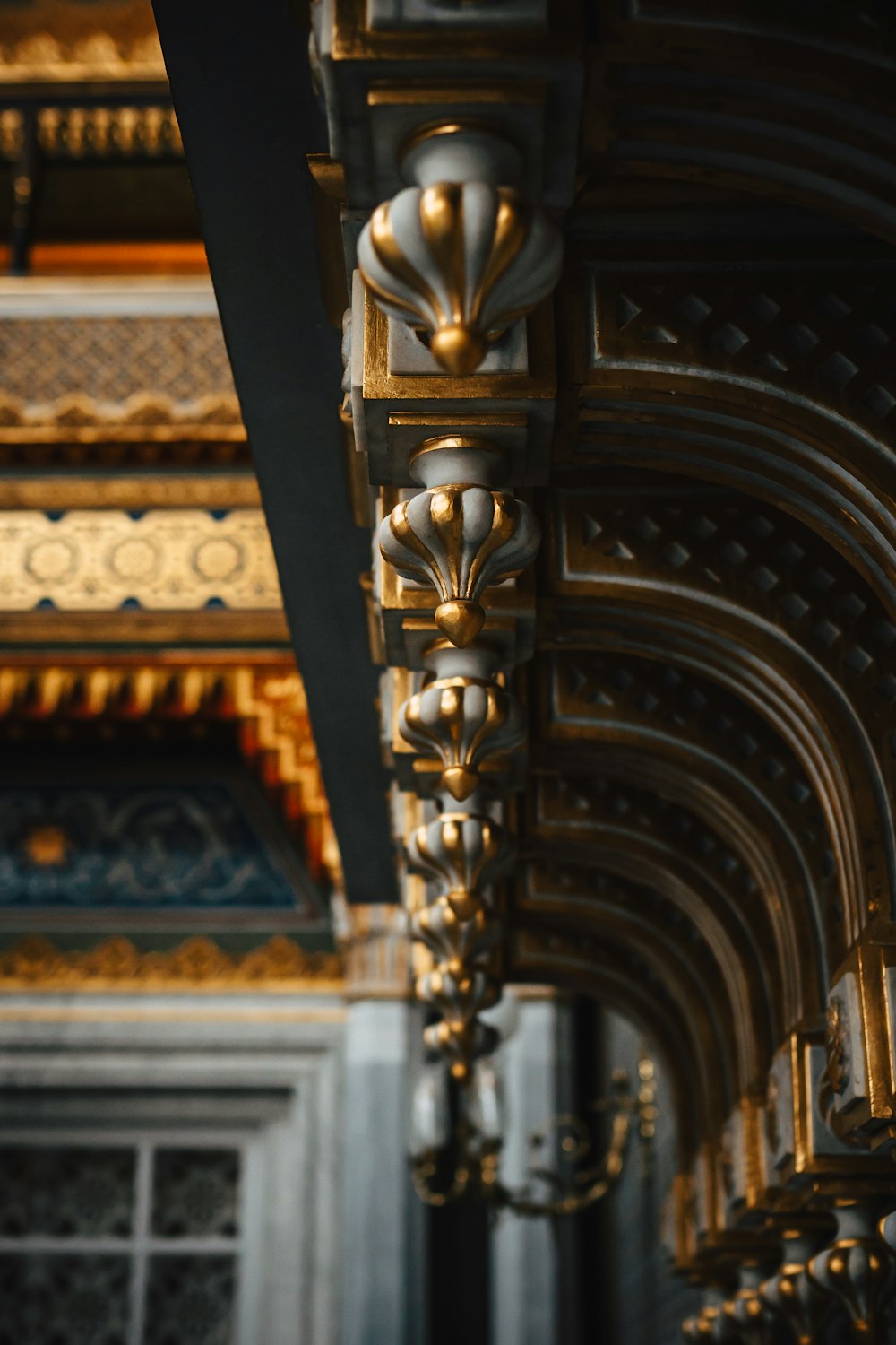 a close up of a metal structure with a clock on it