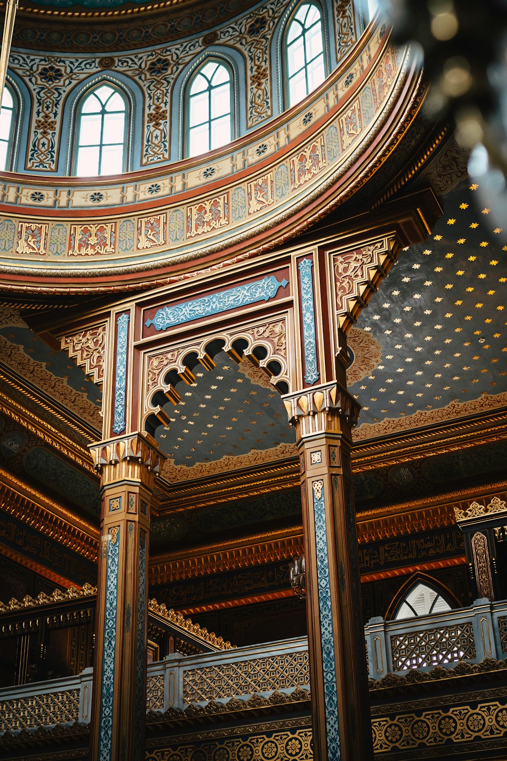 an ornate building with a circular ceiling and windows