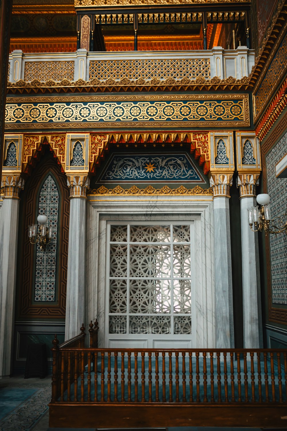 a wooden bench sitting in front of a window