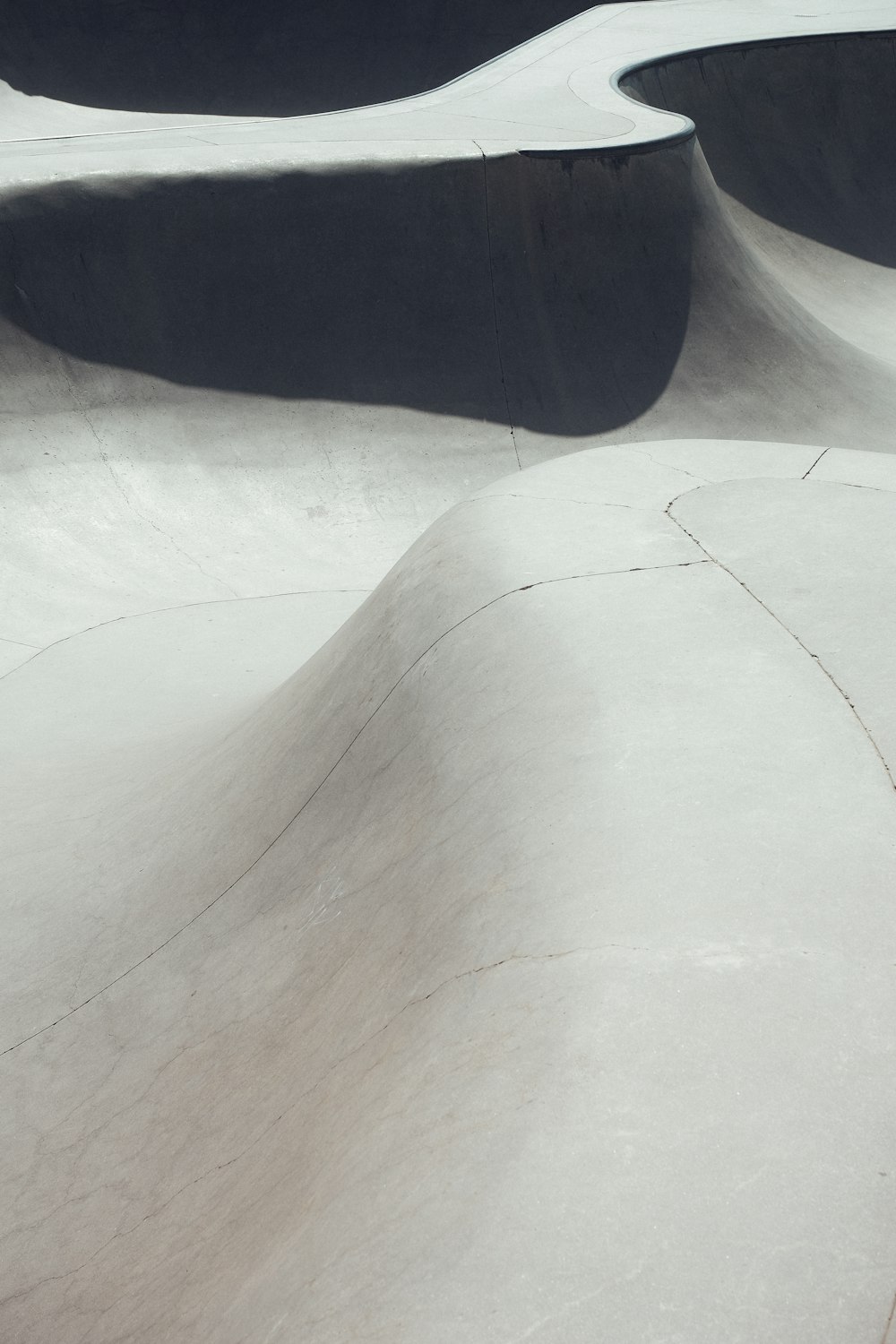 a man riding a snowboard down the side of a snow covered slope