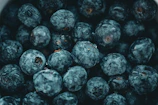 a close up of a bowl of blueberries