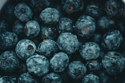 a close up of a bowl of blueberries