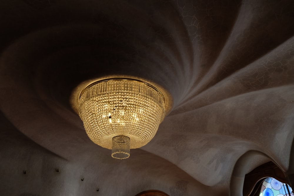 a chandelier hanging from the ceiling of a church