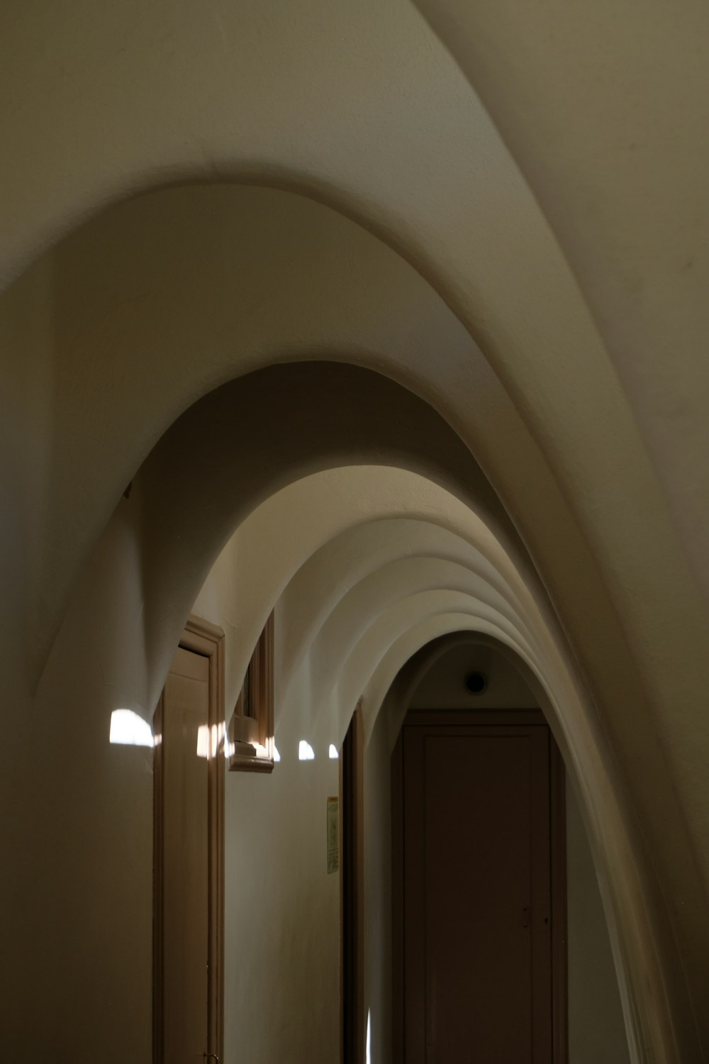 a long hallway with a clock on the wall