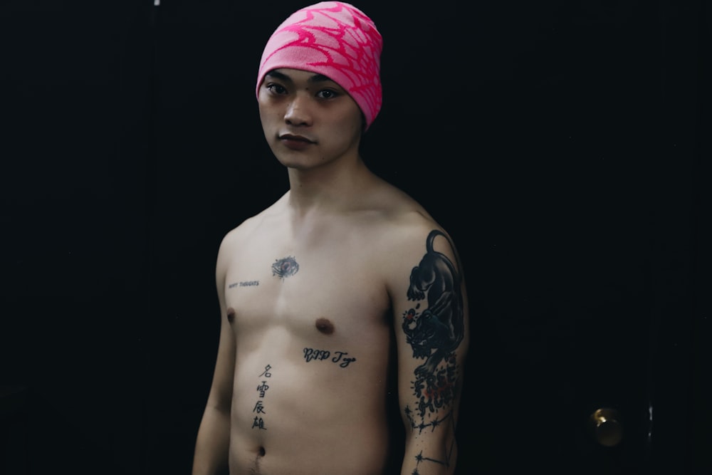 a man with a pink towel on his head