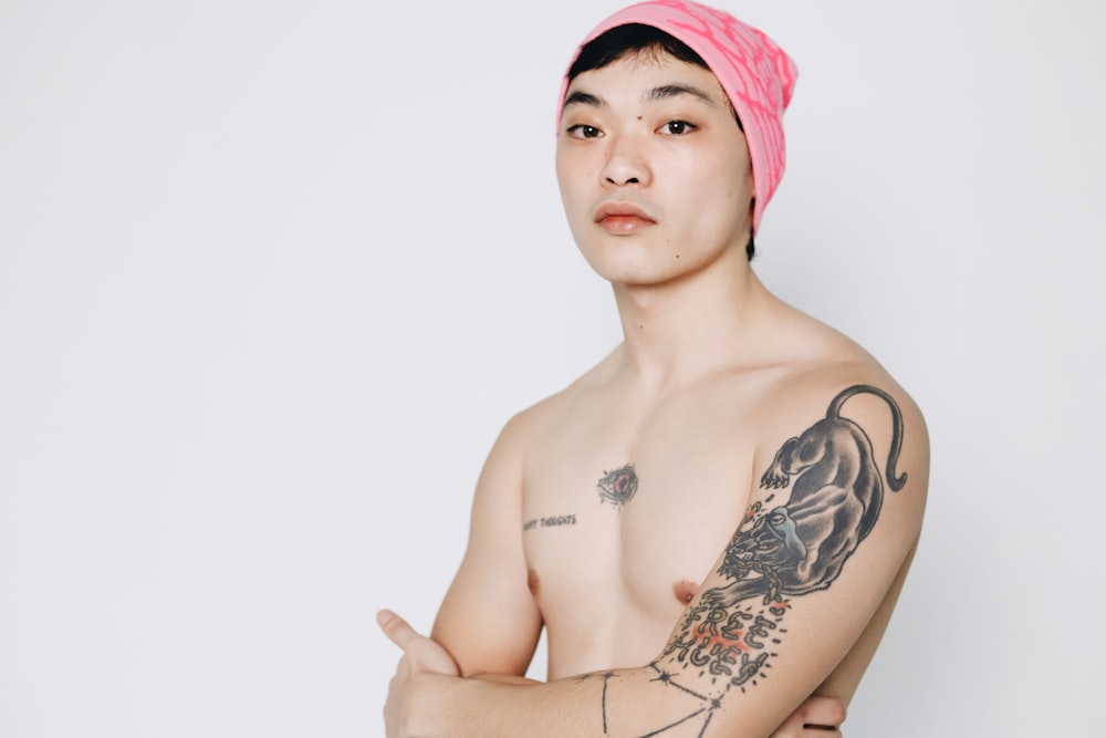 a man with a pink towel on his head