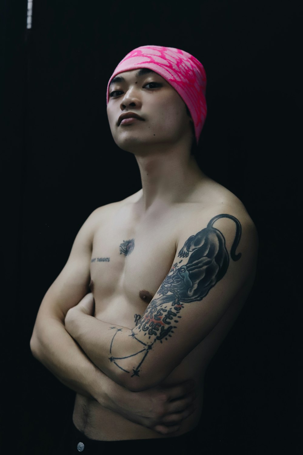 a man with a pink towel on his head