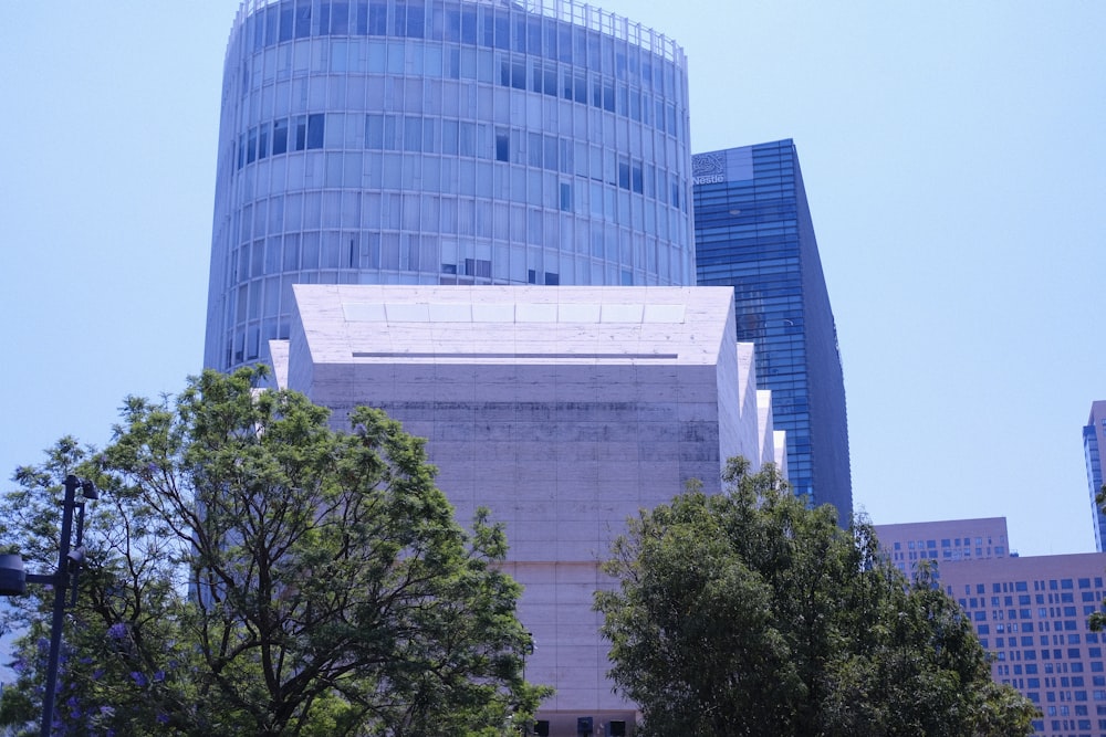 a tall building with a sky scraper in the background