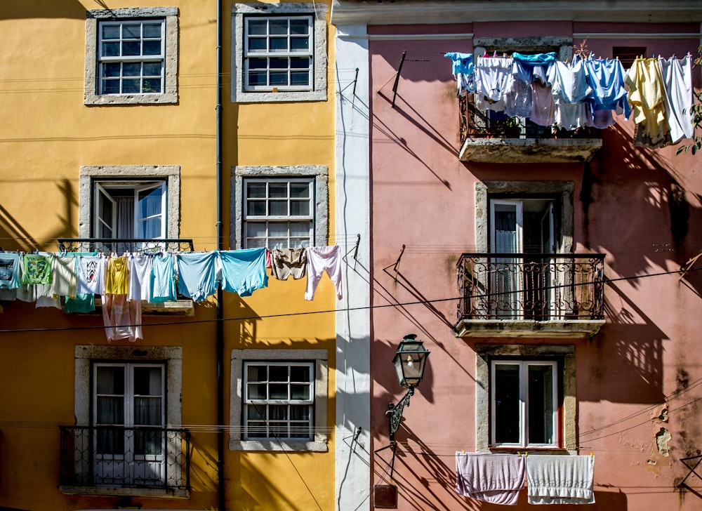 a couple of buildings that have clothes hanging out to dry