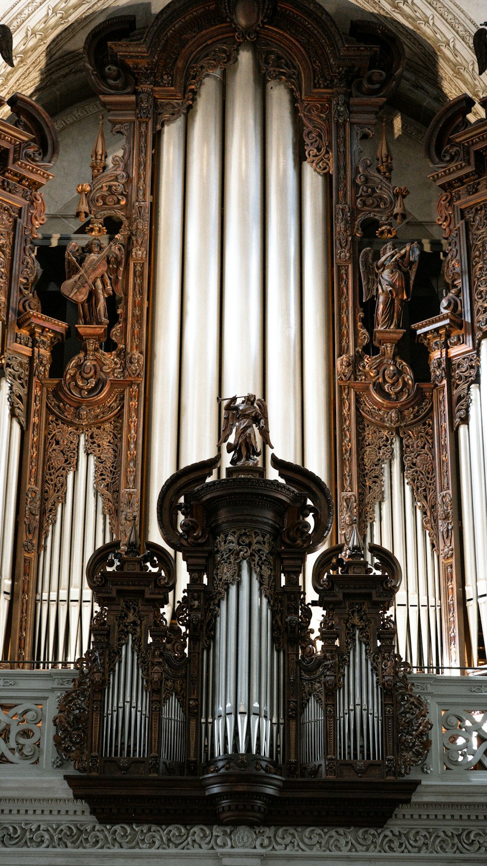 an ornate pipe organ in a church