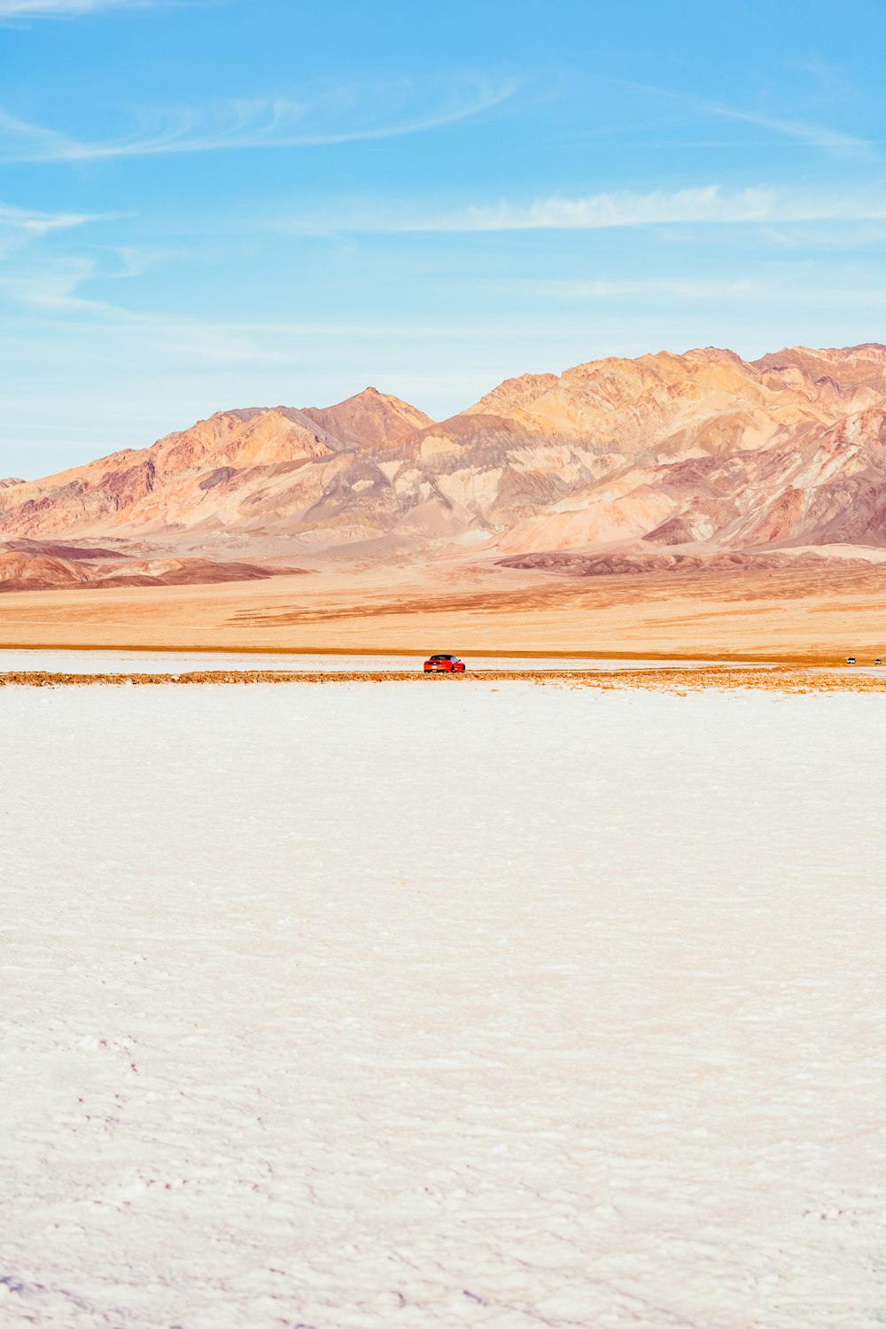 a person riding a horse across a snow covered field