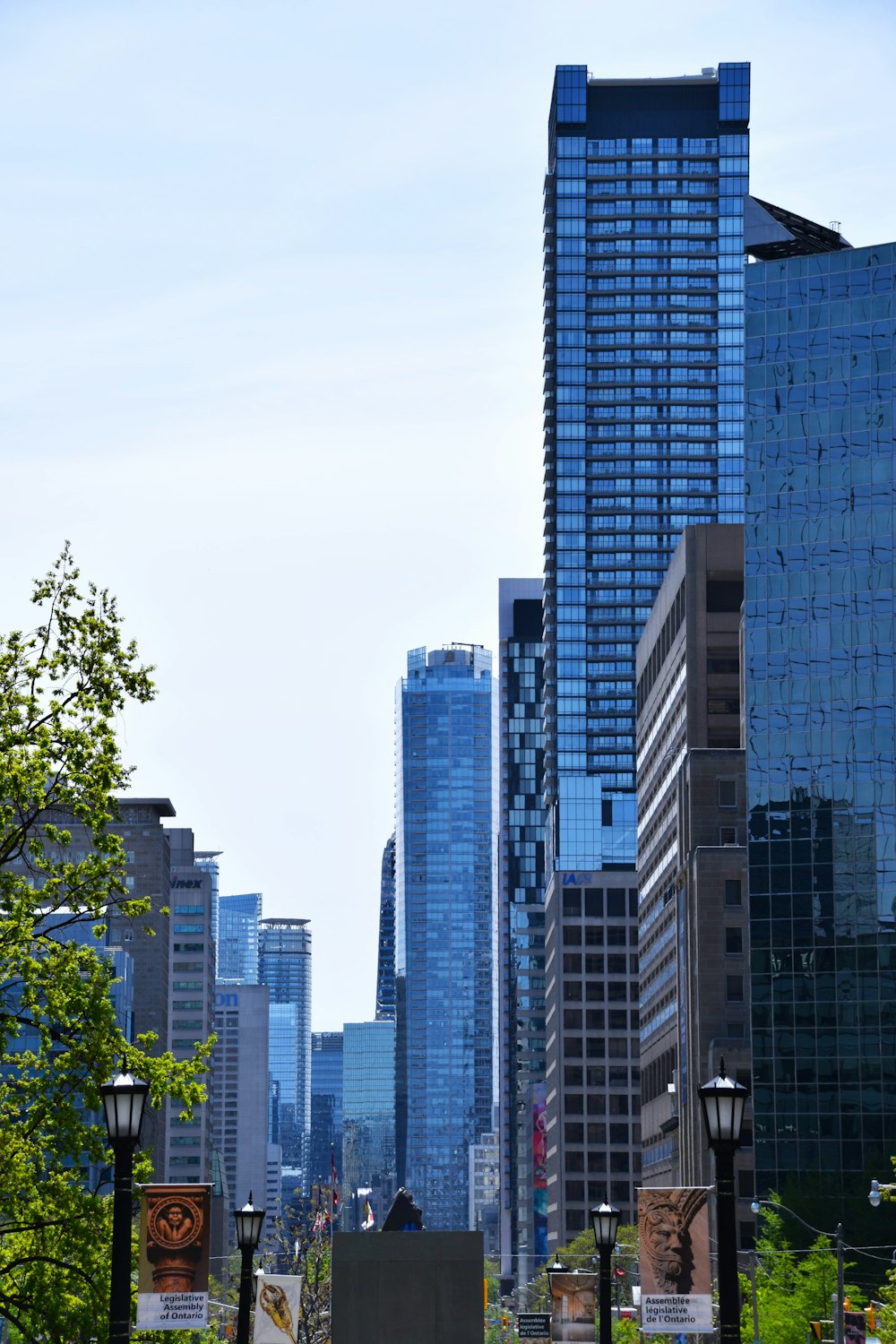 a city street with tall buildings in the background