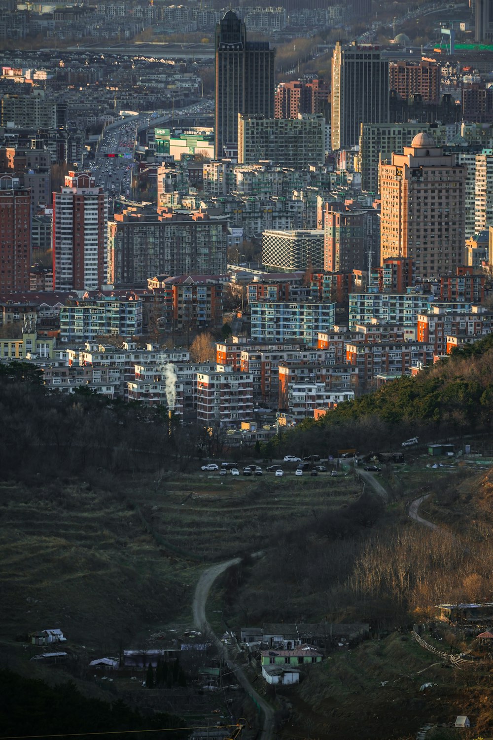 a view of a city from a hill