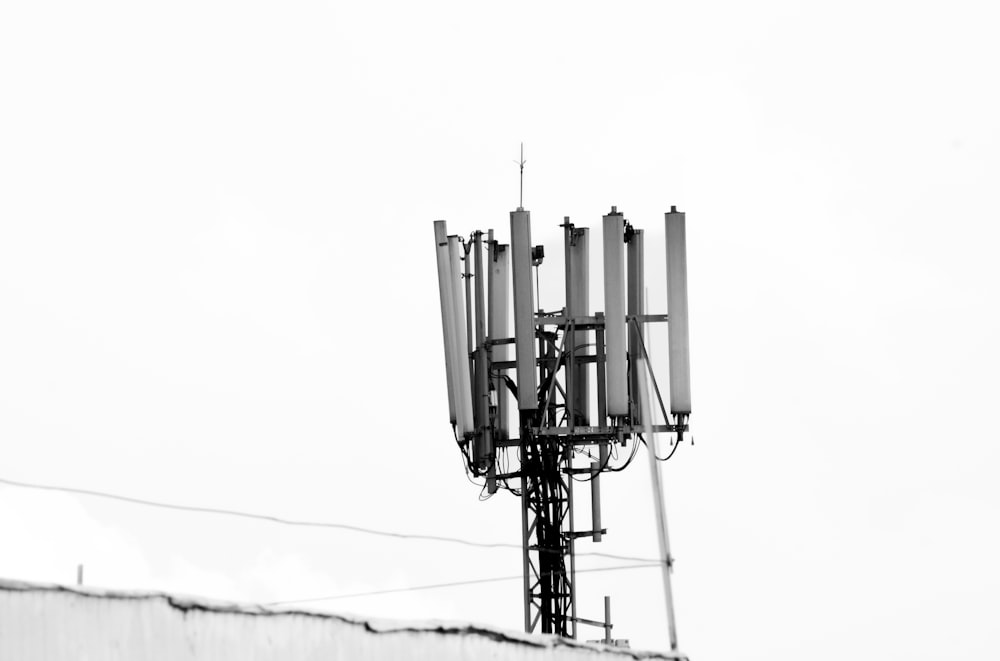 a black and white photo of a cell phone tower