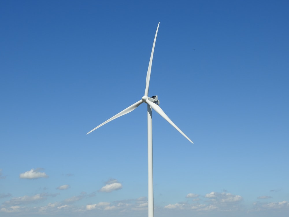 a wind turbine in the middle of a field