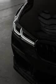 a close up of the front of a black car