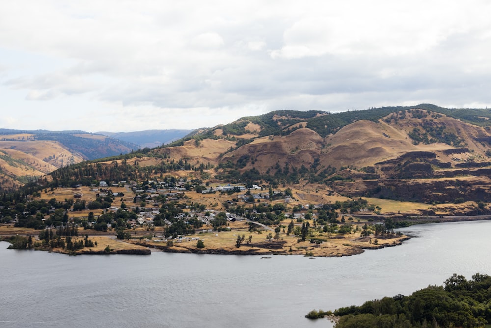 a lake surrounded by mountains and a town