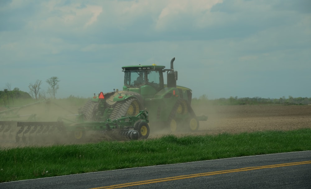 a tractor plowing a field with a plow