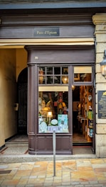 a store front with a sign in front of it