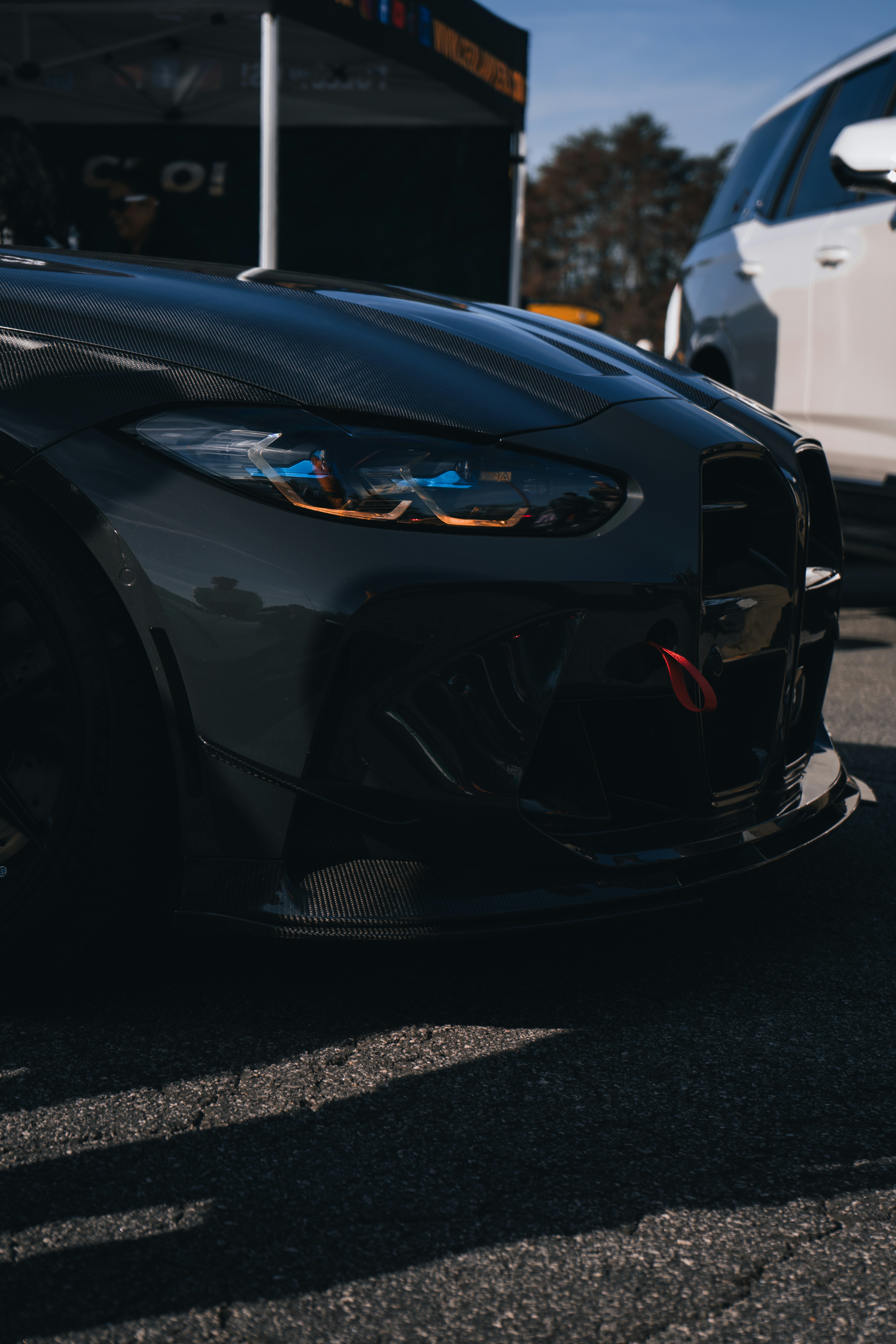 a black sports car parked in a parking lot