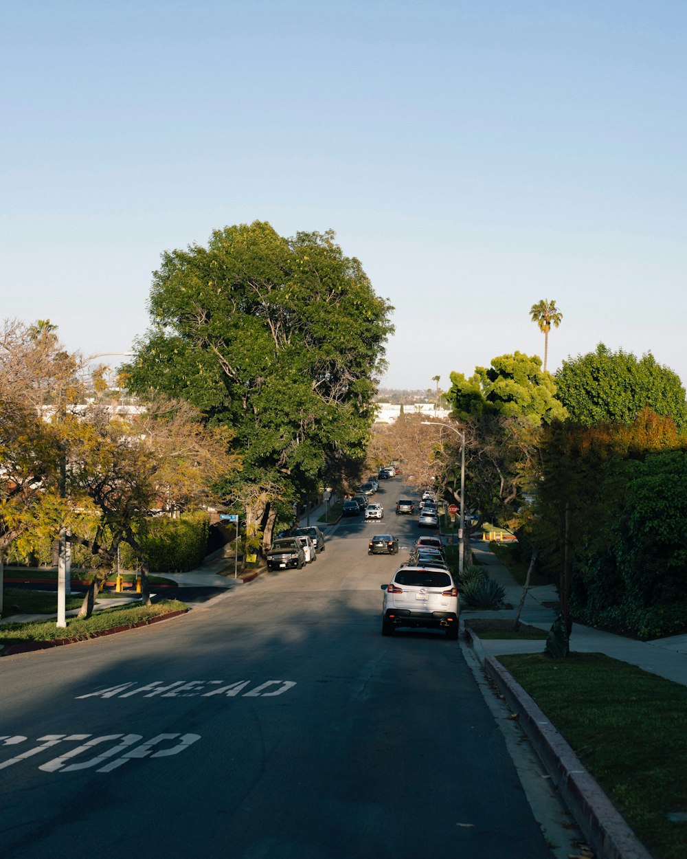 a street with cars parked on the side of it