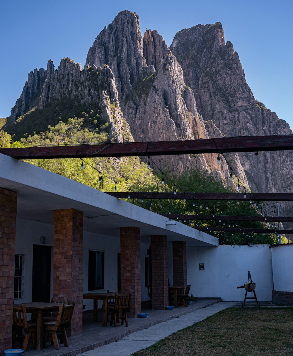 a patio with a mountain in the background