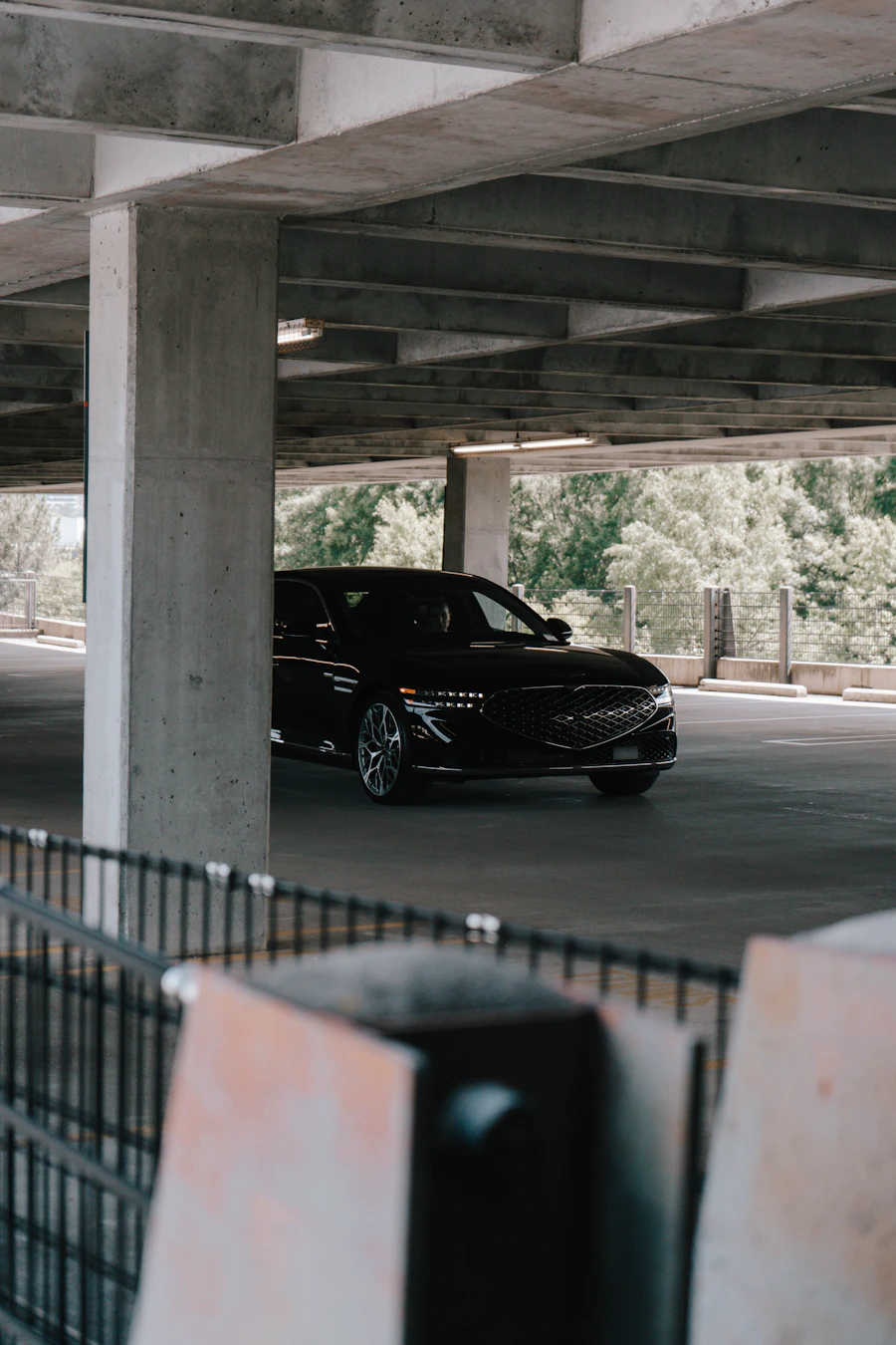 Dark luxury car in an automotive garage