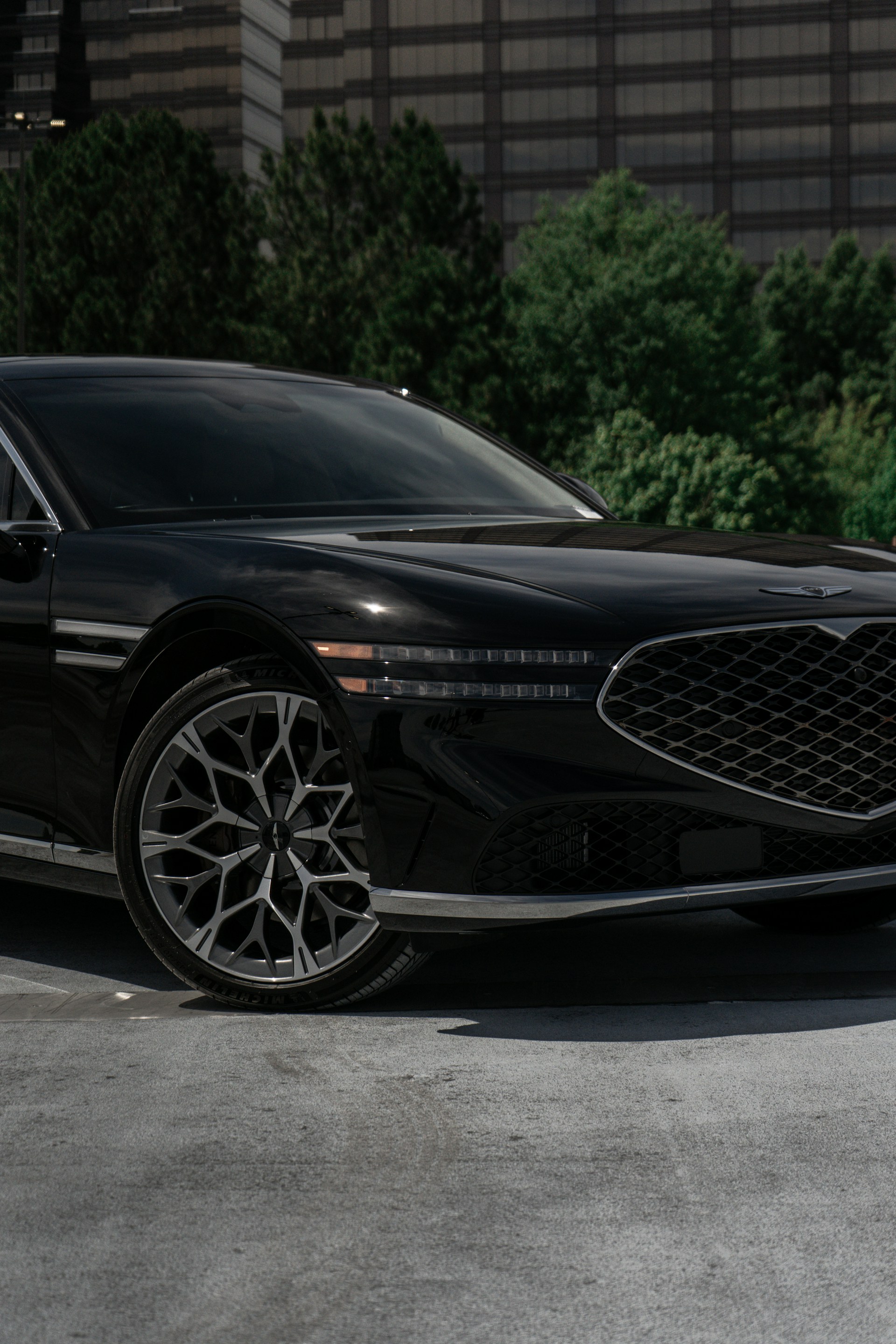 a black car parked in a parking lot