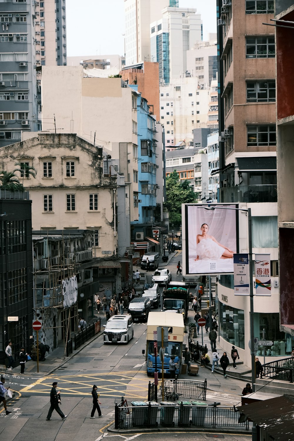 a city street filled with lots of tall buildings