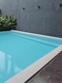 a large swimming pool with a tiled floor Pool Detail Sagaponack, NY