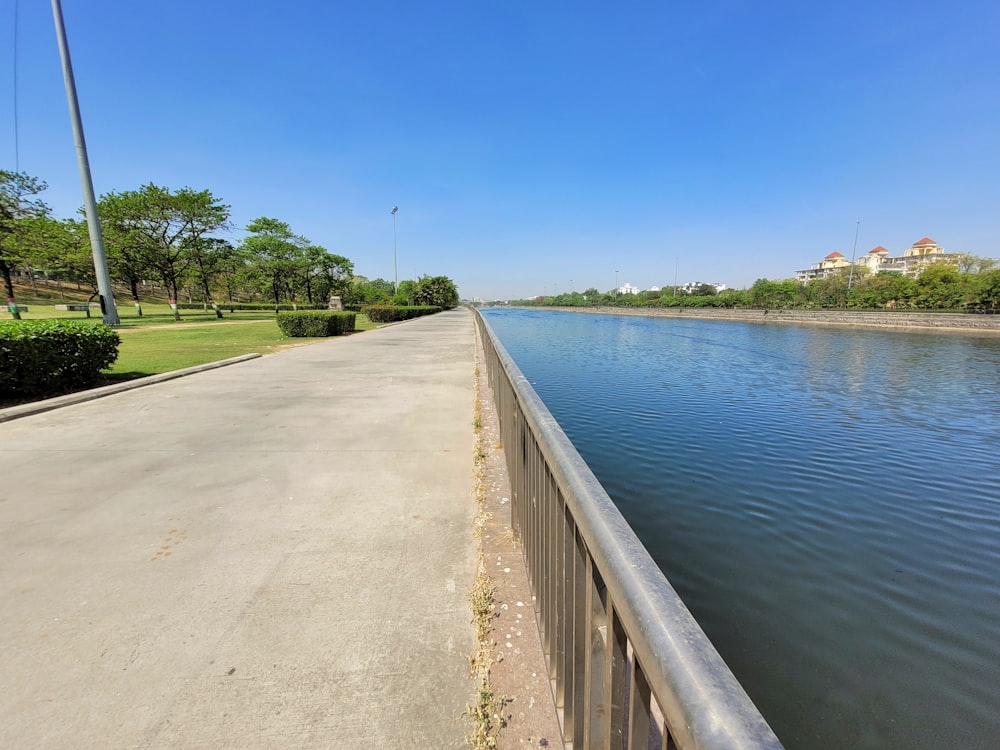 a road next to a body of water