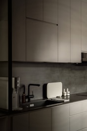 a black and white photo of a kitchen