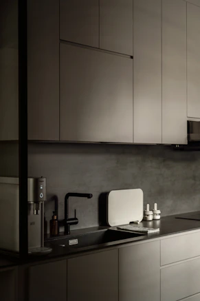 a black and white photo of a kitchen