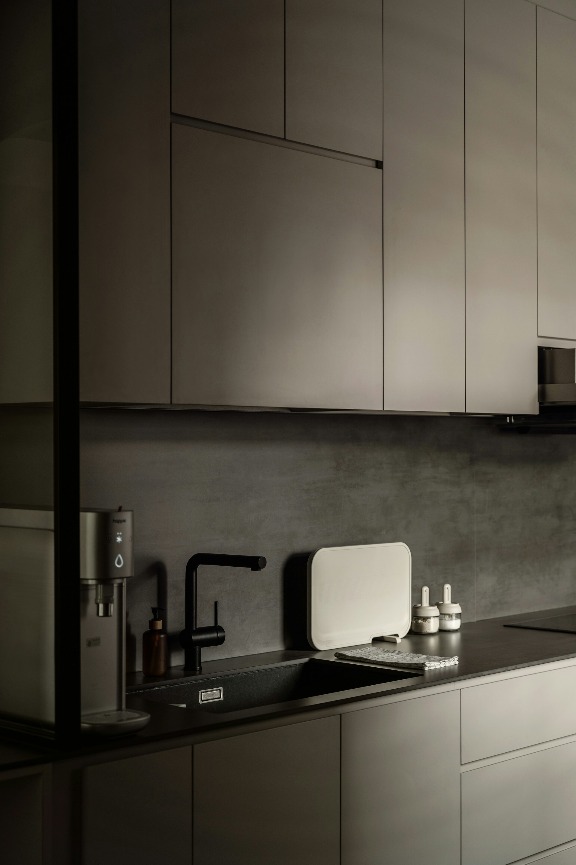 a black and white photo of a kitchen