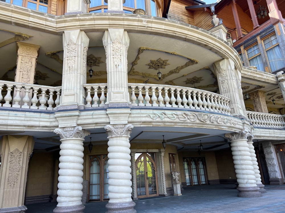 a large white building with a balcony and balconies